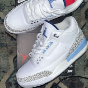 Nike White and Blue Sneakers with Iconic Design